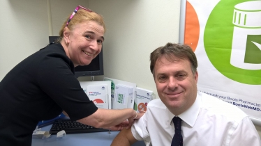 Julian Sturdy receiving his flu jab at Boots Pharmacy in Haxby