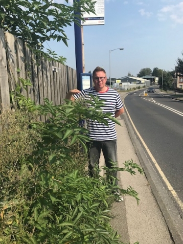Paul Doughty with Overgrown Weeds on Leeman Road
